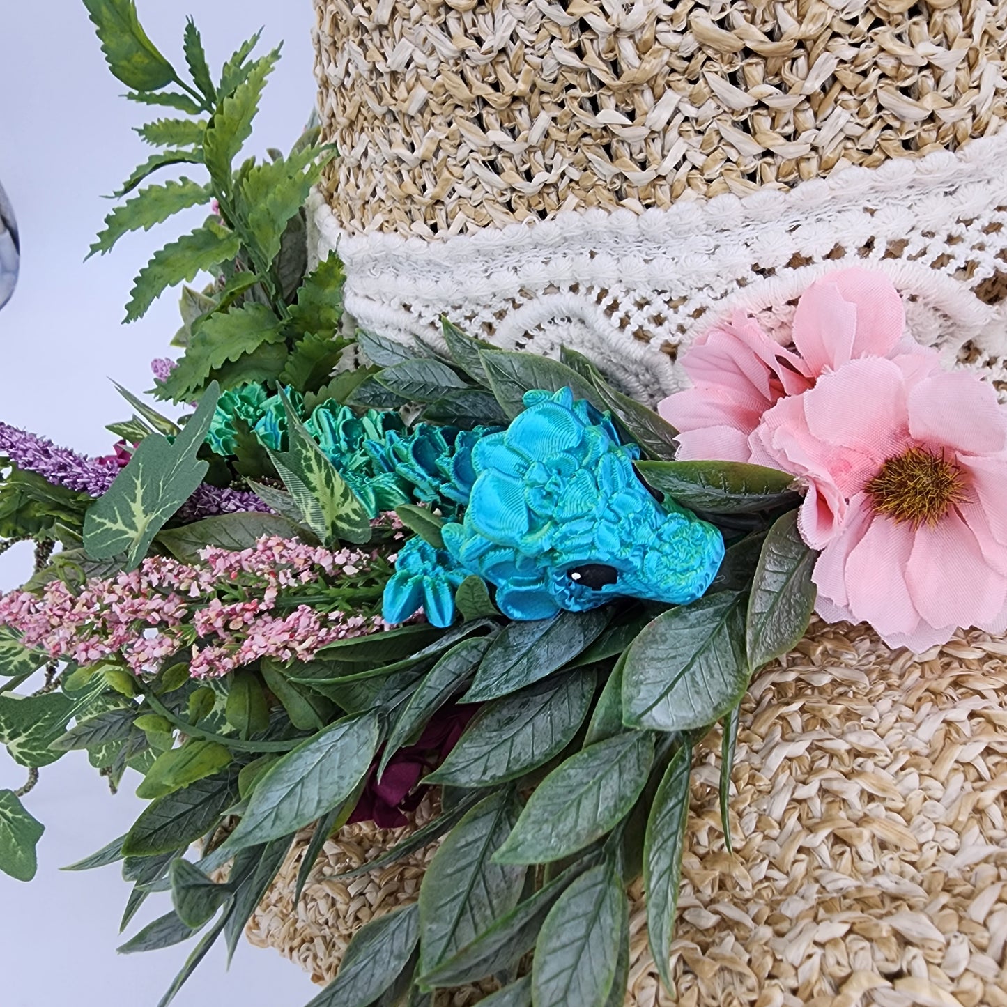 S204- Straw witch hat with floral dragon decoration