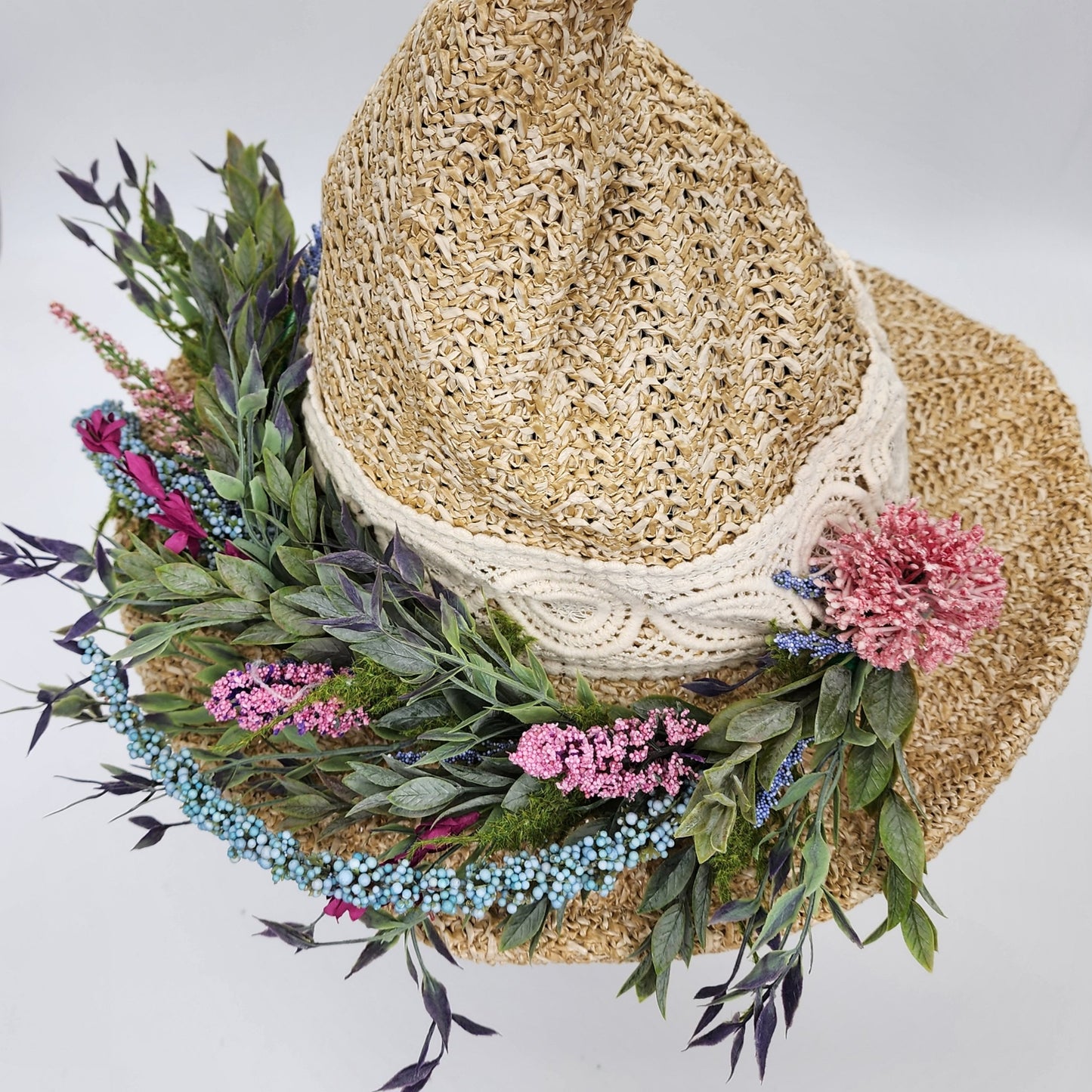 S208- Straw witch hat with floral decoration