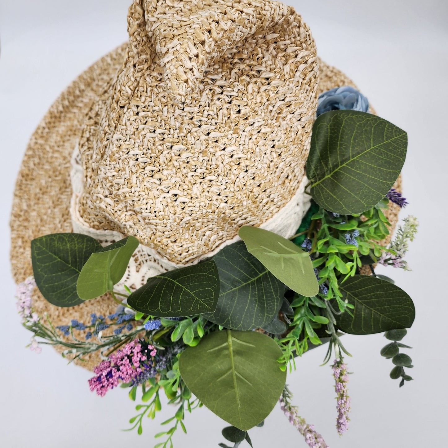 S209- Straw witch hat with floral decoration
