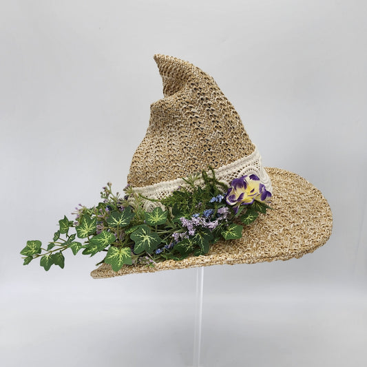 S206- Straw witch hat with floral decoration