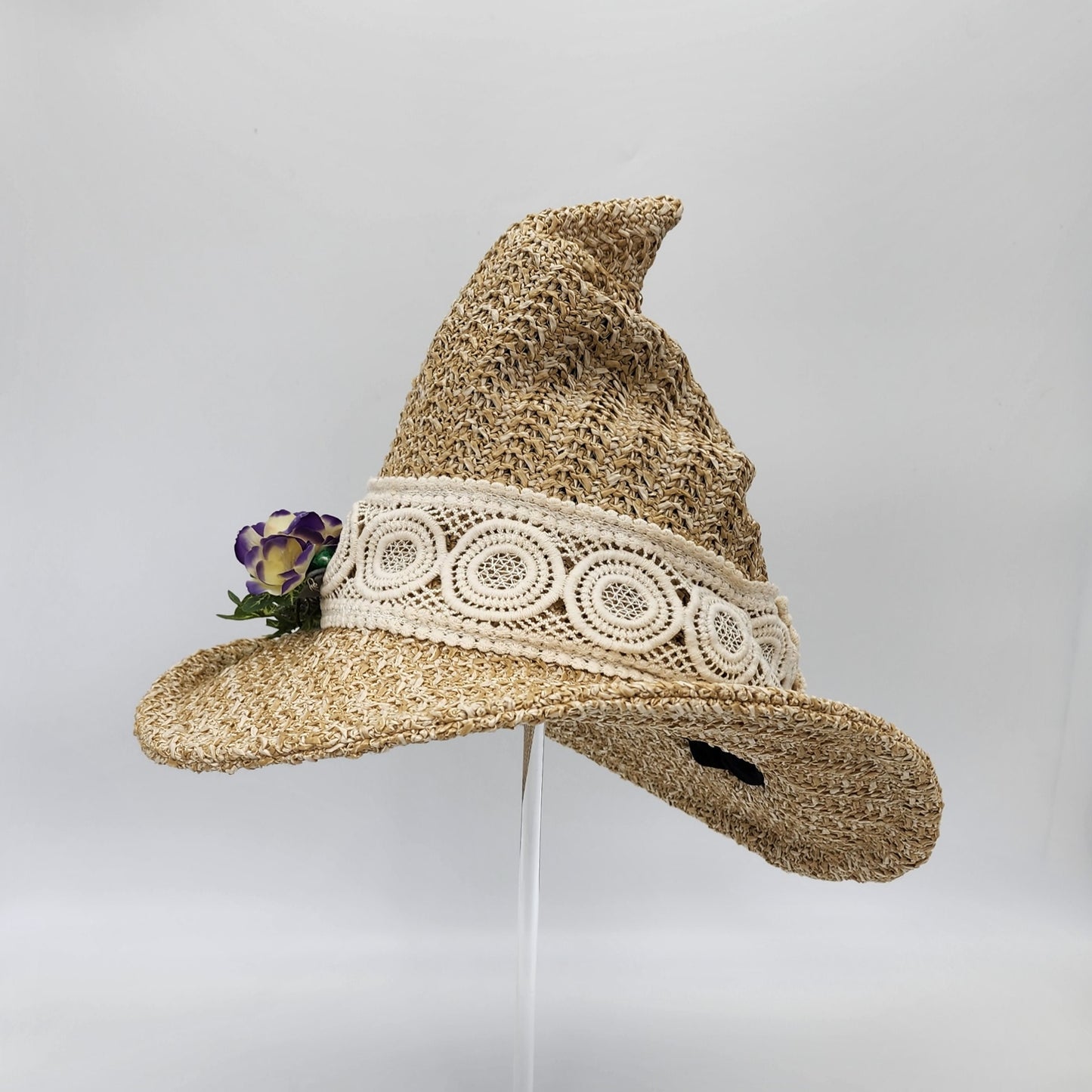 S206- Straw witch hat with floral decoration