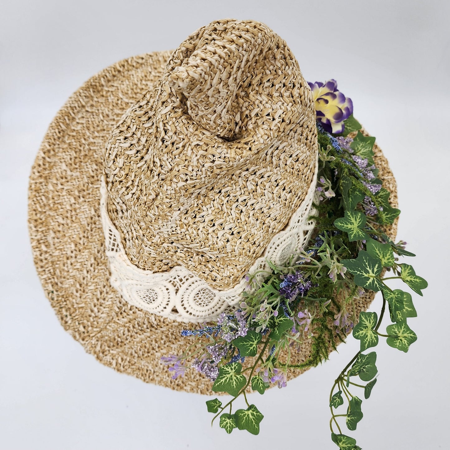 S206- Straw witch hat with floral decoration