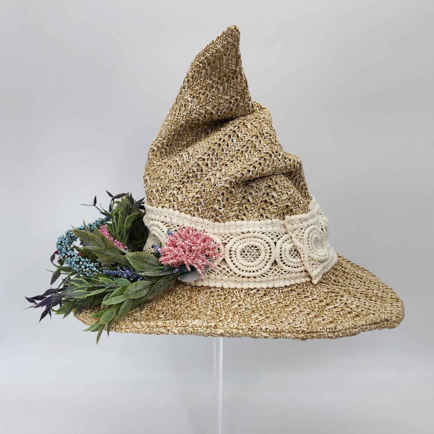 S208- Straw witch hat with floral decoration