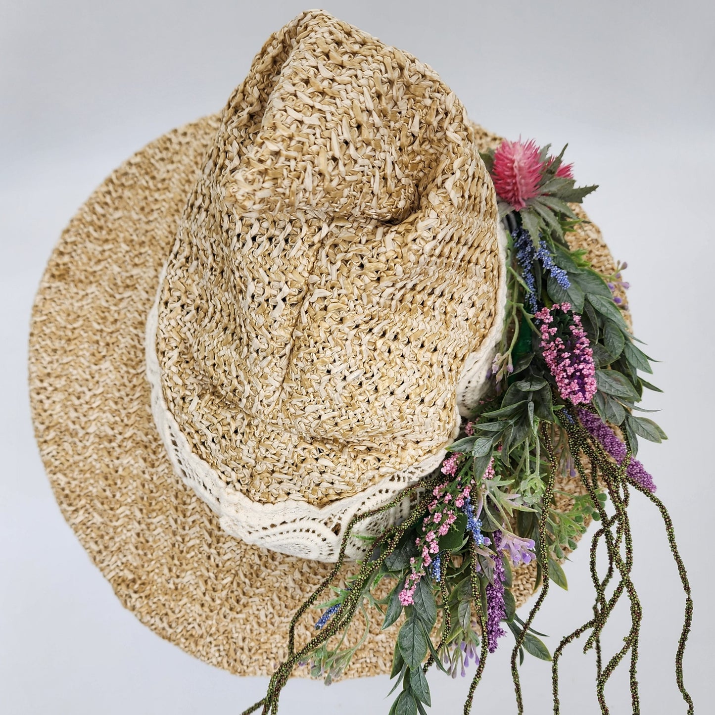 S210- Straw witch hat with floral decoration