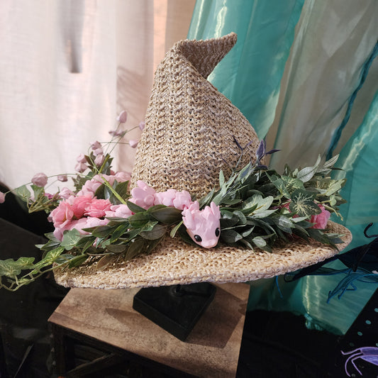 Straw witch hat with floral snake decoration