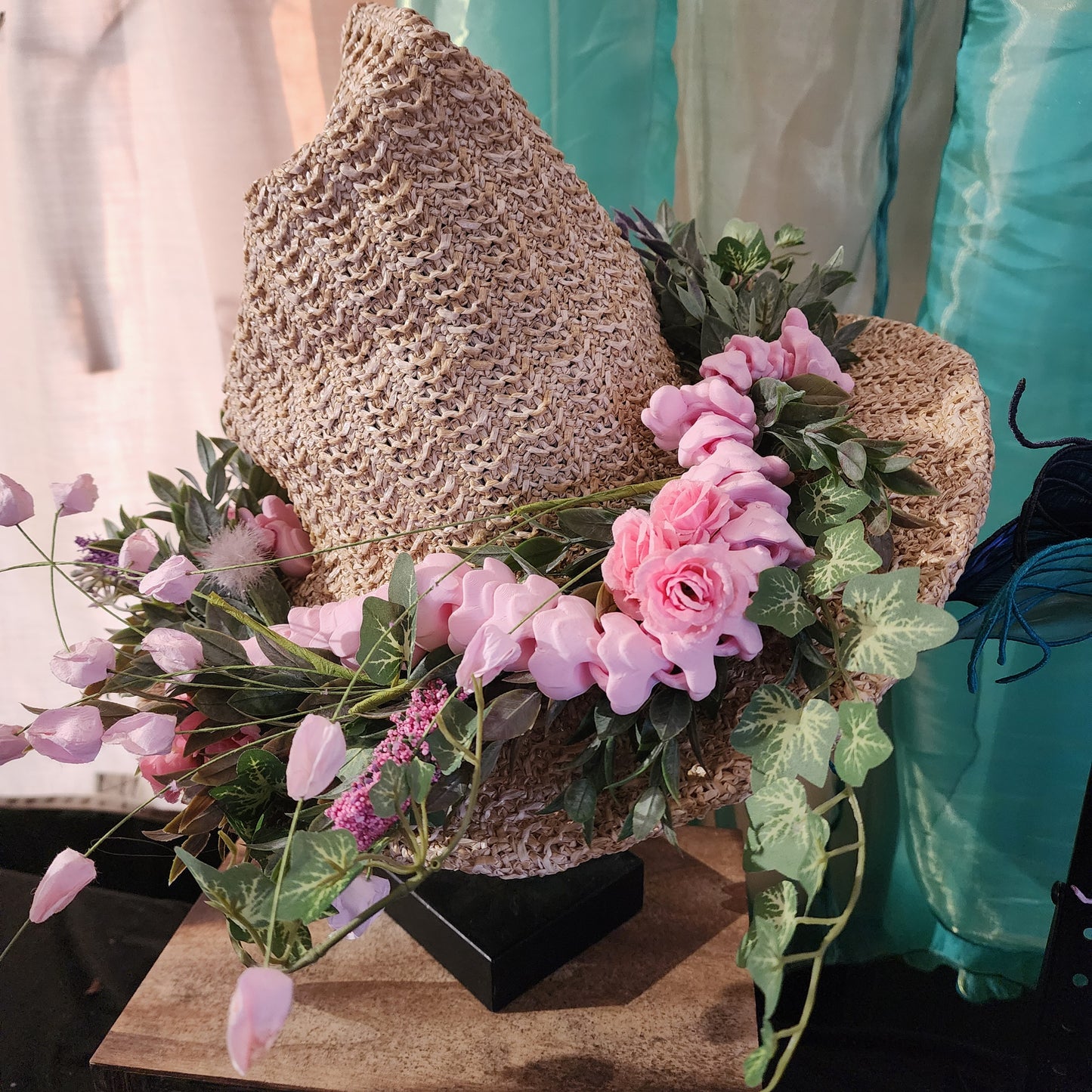 Straw witch hat with floral snake decoration