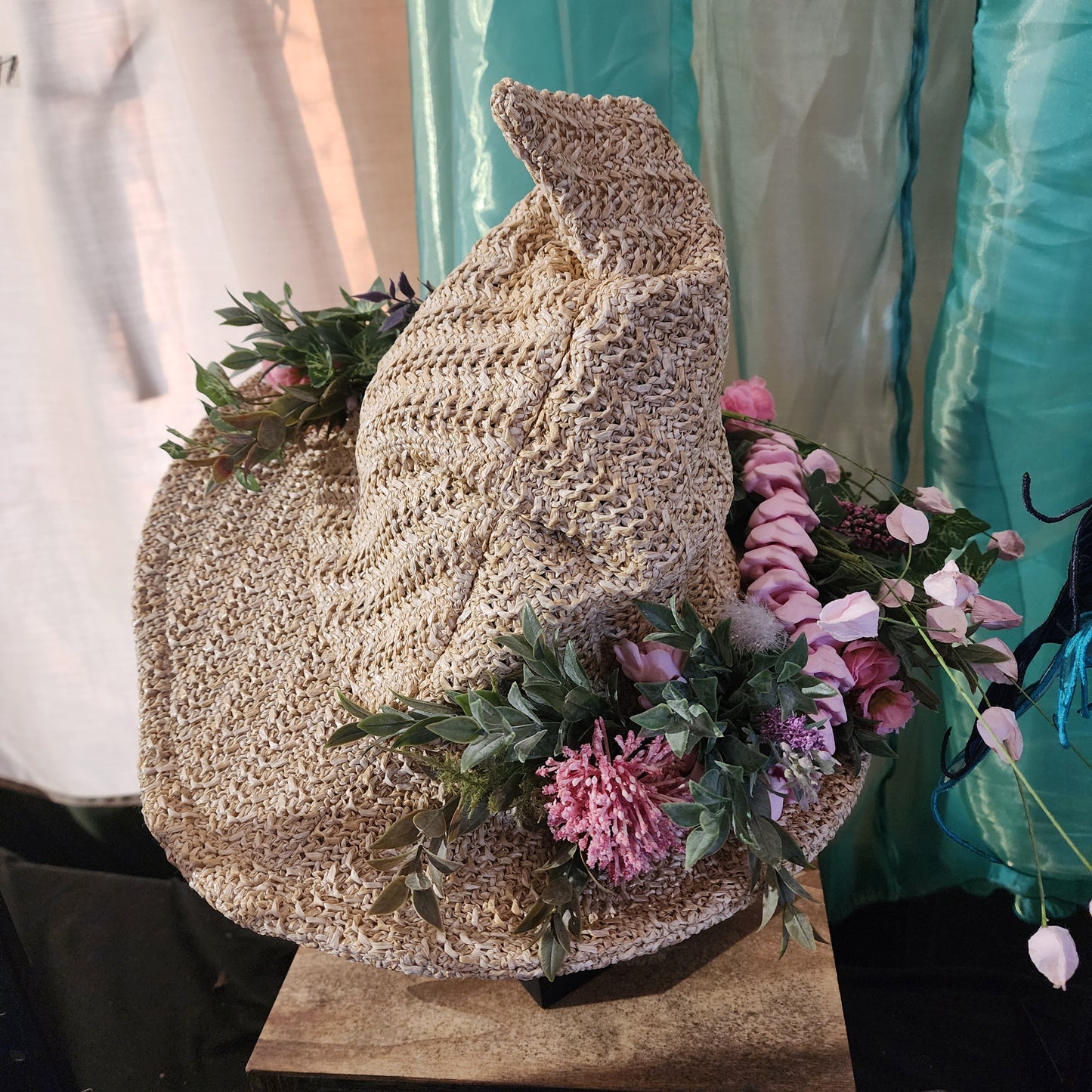 Straw witch hat with floral snake decoration