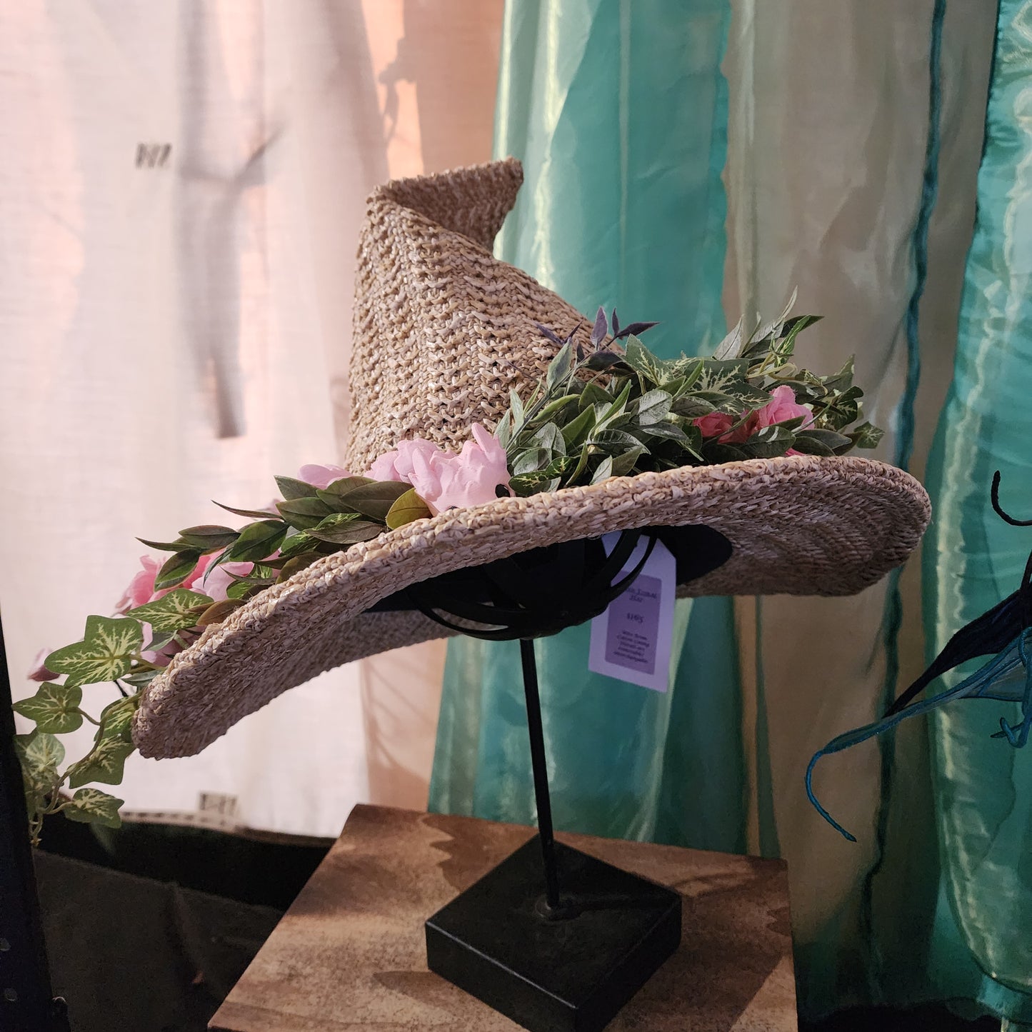 Straw witch hat with floral snake decoration